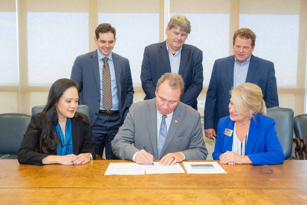 Photo: Commission Chairman Alec Farmer signs the Federal Highway Administration’s Record of Decision identifying the Selected Alternative for the Future Interstate 57 corridor between Walnut Ridge and the Missouri State line.
